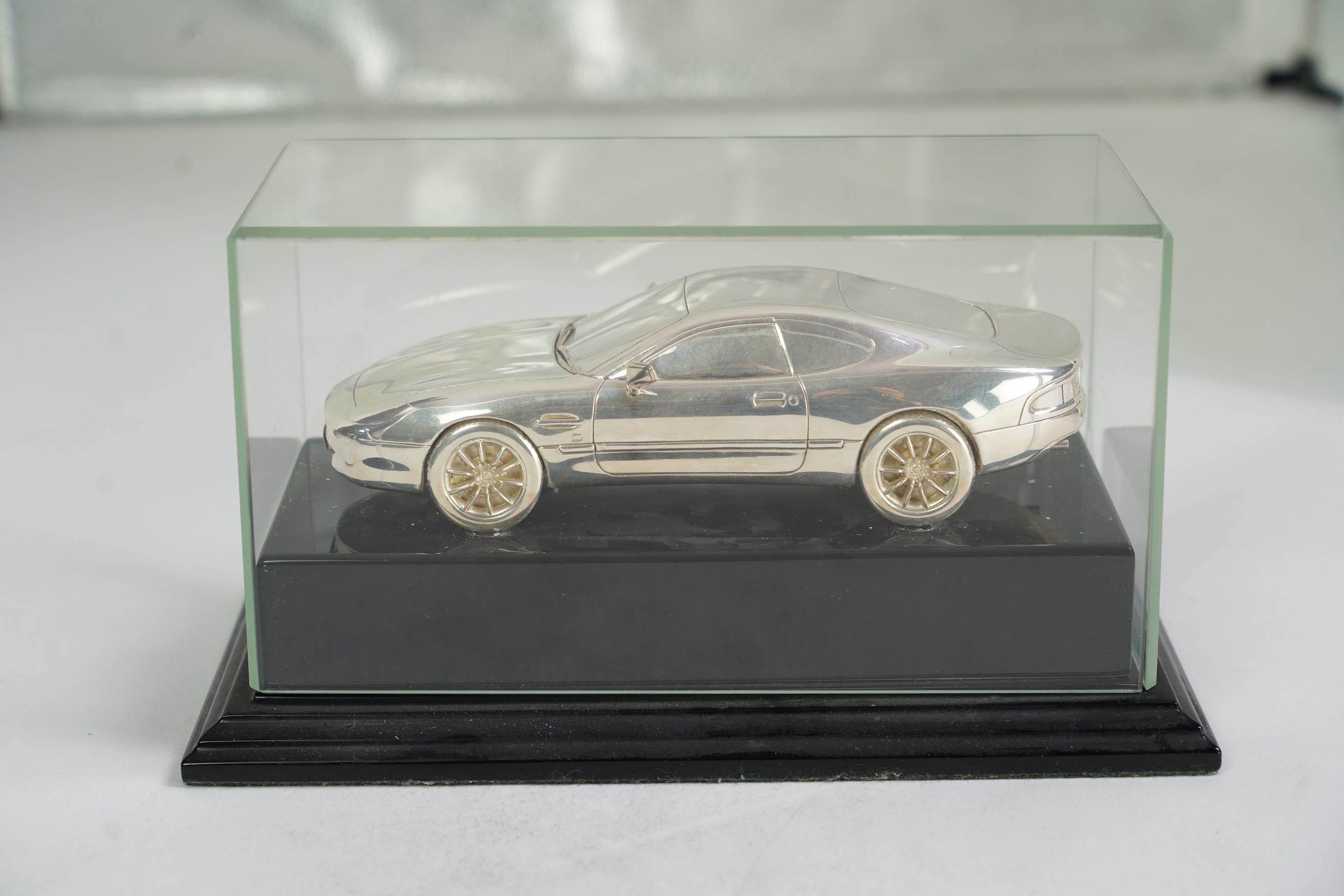 An Elizabeth II miniature silver model of an Aston Martin DB7 Vantage, by Aston Martin Lagonda Design Ltd